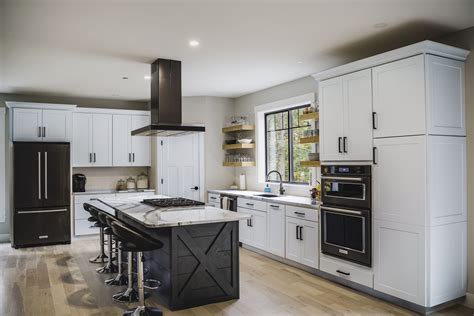 white shaker cabinets with black stainless steel appliances|white kitchen with black fixtures.